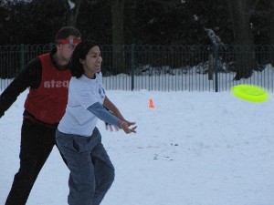 Chapala throws a forehand up the line - men and women play together in Ultimate Frisbee