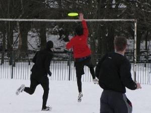 Stevie catches an Ultimate Frisbee point in the snow, Didsbury, Manchester